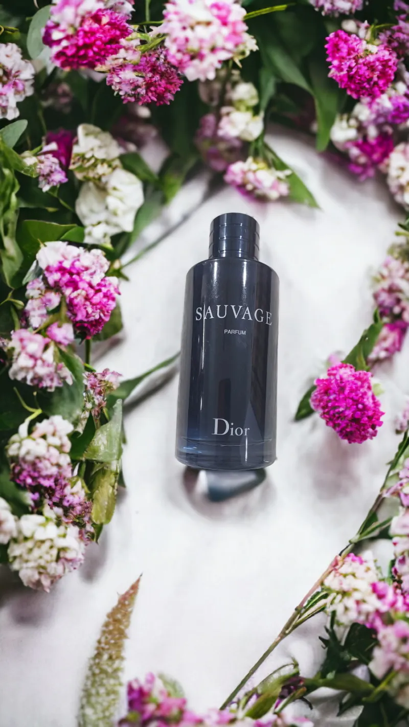 Dior Sauvage bottle with pink flowers